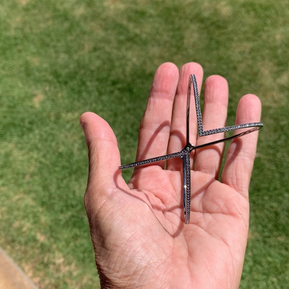 A beautiful silver bracelet with crystals on the outside of the bracelet. - Picture 7 of 8